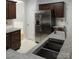 Updated kitchen with granite countertops, stainless steel appliances, and dark wood cabinetry at 7814 Rolling Meadows Ln, Huntersville, NC 28078