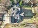 Enjoy the spacious yard with many outdoor features including a built-in outdoor kitchen and fireplace at 820 Cooks Cove Rdg, Lake Wylie, SC 29710