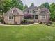 Stunning brick home with manicured lawn, elegant landscaping, and a welcoming entrance at 820 Cooks Cove Rdg, Lake Wylie, SC 29710