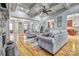 Cozy living room with stone fireplace, hardwood floors, coffered ceilings and neutral color palette at 820 Cooks Cove Rdg, Lake Wylie, SC 29710