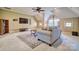 Open living room with carpet, television, shelving, and windows for natural light at 820 Cooks Cove Rdg, Lake Wylie, SC 29710