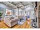 Spacious living room boasting coffered ceilings, a stone fireplace, and hardwood floors at 820 Cooks Cove Rdg, Lake Wylie, SC 29710
