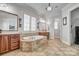Spa-like bathroom with a soaking tub, double vanity, tile flooring, and lots of natural light at 820 Cooks Cove Rdg, Lake Wylie, SC 29710