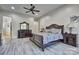 Main bedroom with hardwood floors, neutral walls, a ceiling fan, and furnishings at 820 Cooks Cove Rdg, Lake Wylie, SC 29710