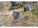 Aerial view of a home showcasing the surrounding landscape, roof, and driveway at 8260 Graham Rd, Denver, NC 28037