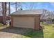 A detached two car brick garage with an automatic door and ample parking at 8260 Graham Rd, Denver, NC 28037