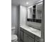 Updated bathroom featuring a double sink vanity with granite countertops and framed mirrors at 84 13Th Se St, Hickory, NC 28601