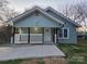 Charming home featuring a welcoming front porch and a freshly poured concrete driveway at 84 13Th Se St, Hickory, NC 28601