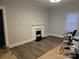 Spacious living room with decorative fireplace and hardwood floors at 84 13Th Se St, Hickory, NC 28601