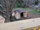 Old shed with overgrown vines and trees needs TLC to be useful at 84 13Th Se St, Hickory, NC 28601