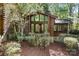 View of the screened-in porch attached to the log home at 1007 Mistywood Ln, Concord, NC 28027