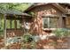 Exterior view showcasing wood siding, large window, and screened in porch at 1007 Mistywood Ln, Concord, NC 28027