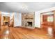 Spacious living room with stone fireplace, hardwood floors, and built in cabinets at 1007 Mistywood Ln, Concord, NC 28027