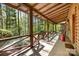 View of cozy front porch overlooking green landscape at 1007 Mistywood Ln, Concord, NC 28027