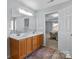 Bathroom with double sinks and views into bedroom at 1016 Council Fire Cir, Indian Trail, NC 28079
