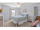 Bedroom with a plush bed, neutral carpet, bright window and a contemporary decor at 1016 Council Fire Cir, Indian Trail, NC 28079