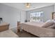 Bedroom with plush carpet, ceiling fan, large window and a neutral color palette at 1016 Council Fire Cir, Indian Trail, NC 28079