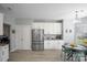 Eat-in kitchen offers stainless steel appliances, white cabinets, granite countertops, and adjacent dining area at 1016 Council Fire Cir, Indian Trail, NC 28079