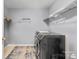 Functional laundry room featuring modern washer and dryer units and wire shelving at 1016 Council Fire Cir, Indian Trail, NC 28079