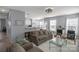 Open concept living room with modern decor and access to kitchen and dining area at 1016 Council Fire Cir, Indian Trail, NC 28079
