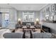 Comfortable living room with gray sofa, stylish lamps, neutral rug, modern décor and an inviting atmosphere at 1016 Council Fire Cir, Indian Trail, NC 28079