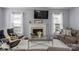 Comfortable living room with fireplace and large tv at 1016 Council Fire Cir, Indian Trail, NC 28079