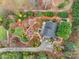 Stunning aerial view of a home featuring meticulous landscaping with winding stone pathways at 106 Brookwood Ln, Taylorsville, NC 28681