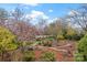 Beautifully landscaped yard featuring a mature magnolia tree, stone pathways and lush shrubbery at 106 Brookwood Ln, Taylorsville, NC 28681