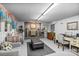 Finished basement area features a fireplace, comfortable seating, and work area at 106 Brookwood Ln, Taylorsville, NC 28681