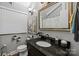 Charming bathroom features stylish vanity, classic fixtures, and modern décor at 106 Brookwood Ln, Taylorsville, NC 28681