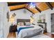 Relaxing bedroom features a fireplace, wood ceiling, and stylish accents at 106 Brookwood Ln, Taylorsville, NC 28681