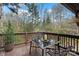 Relaxing deck with a dining table and chairs, offering a peaceful outdoor retreat with natural view and candlelight ambiance at 106 Brookwood Ln, Taylorsville, NC 28681
