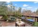 Relaxing deck area with comfortable seating and charming stone water feature at 106 Brookwood Ln, Taylorsville, NC 28681