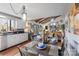 The dining room flows into the kitchen and features an open floor plan, hardwood floors, and a decoratively set table at 106 Brookwood Ln, Taylorsville, NC 28681