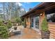 Cozy outdoor patio with a charming wood facade, offering a tranquil space for relaxation at 106 Brookwood Ln, Taylorsville, NC 28681