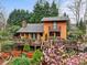 Charming multi-story home with a beautiful wooden deck and surrounding lush landscaping at 106 Brookwood Ln, Taylorsville, NC 28681
