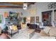 This living room has a fireplace, vaulted ceiling, hardwood floors, and a collection of unique art pieces at 106 Brookwood Ln, Taylorsville, NC 28681