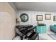 Cozy living room showcasing a black baby grand piano with a blue accent cabinet and decor at 106 Brookwood Ln, Taylorsville, NC 28681