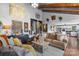 The living room has an artfully decorated interior with a hardwood floor, vaulted ceiling, and modern decor at 106 Brookwood Ln, Taylorsville, NC 28681