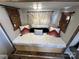 Cozy bedroom featuring a bed with decorative pillows and window coverings at 108 Robin Ln, New London, NC 28127