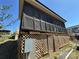 Home exterior showing screened porch and white lattice foundation at 108 Robin Ln, New London, NC 28127