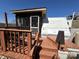 Exterior shows a deck, screened-in porch, and camper under a clear blue sky at 108 Robin Ln, New London, NC 28127