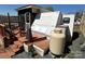 Exterior shows a camper with deck and propane tank under a clear blue sky at 108 Robin Ln, New London, NC 28127
