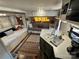 The RV living area includes a daybed and a full kitchen, blending comfort with complete functionality at 108 Robin Ln, New London, NC 28127