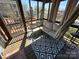 Covered porch features a relaxing seating area with an outdoor view, offering a comfortable space at 108 Robin Ln, New London, NC 28127