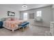 Comfortable bedroom with decorative accents, and bright natural light at 11120 Pagebrook Ln, Charlotte, NC 28214