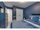 Spacious bedroom featuring navy walls, plush bedding, and access to an ensuite bathroom at 11120 Pagebrook Ln, Charlotte, NC 28214
