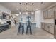 Modern kitchen boasts gray cabinets, stainless steel appliances, and a center island with barstool seating at 11120 Pagebrook Ln, Charlotte, NC 28214
