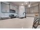 Bright kitchen with white quartz countertops, stainless steel appliances, and modern fixtures at 11120 Pagebrook Ln, Charlotte, NC 28214