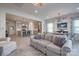 Comfortable living room open to a modern kitchen, featuring ample seating and natural light at 11120 Pagebrook Ln, Charlotte, NC 28214
